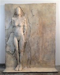 a white sculpture sitting on top of a floor next to a cement wall with cracks in it