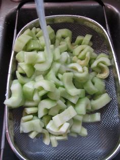 the food is being cooked in the strainer