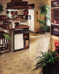 a kitchen with an island and lots of counter space in front of the stove top oven