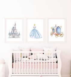 a baby's room with three pictures on the wall and a crib next to it