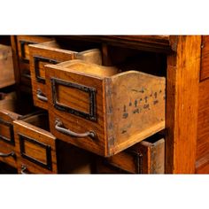 an old wooden desk with drawers and metal handles