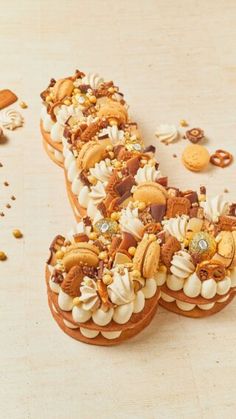 the cookies are decorated with nuts and other things