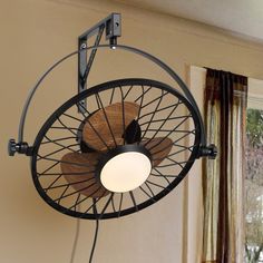 a fan mounted to the side of a wall