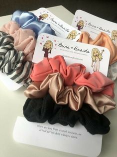 four scrunffle hair ties in various colors and patterns on top of each other