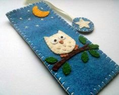 a cell phone case with an owl and moon on it