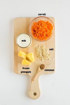 carrots, oats, milk and other ingredients on a cutting board