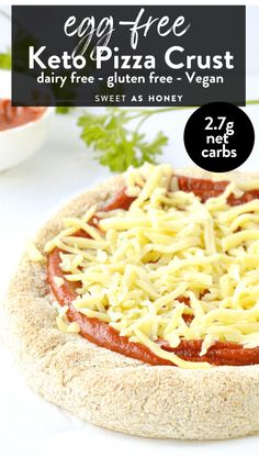 the keto pizza crust is topped with cheese and tomato sauce