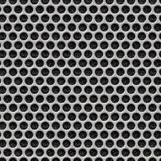 a metal grate with holes in the middle and black dots on it's surface