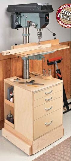 a workbench with drawers and tools in it