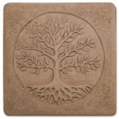 a stone coaster with a tree design on the front and back side, in light brown