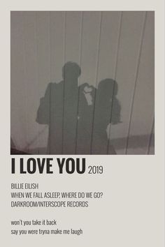 a poster with the words i love you on it and two people standing in front of them