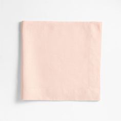 a pink napkin on a white background