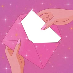 two hands are holding an envelope in the air