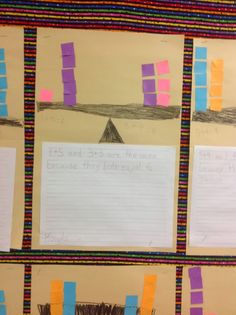 four pieces of paper taped to the side of a bulletin board with writing on them