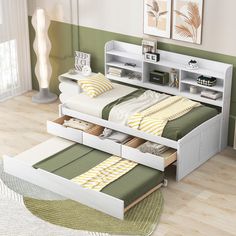 a bed with two drawers underneath it and a book shelf on the top one side