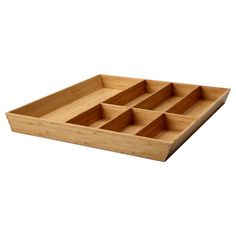 a wooden tray with six compartments on it