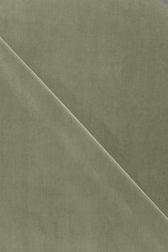 an image of a plain fabric material that looks like it has been dyed in shades of green