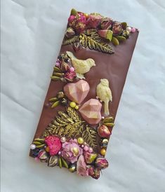 a chocolate bar with flowers and birds on it