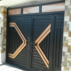 two black doors with wooden slats on them