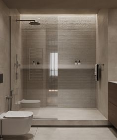 a bathroom with a toilet, sink and shower stall in it's center area