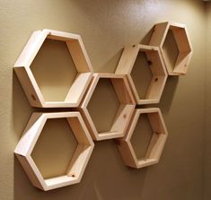 several hexagonal shelves mounted on the wall