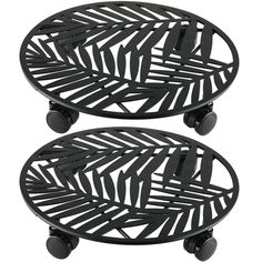 two black metal trays with wheels on them