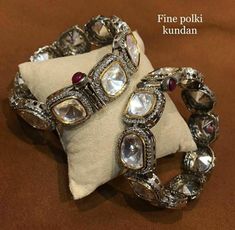 These Glam Victorian Polki Bangles Based in copper with rhodium plating. A perfect accessory for almost anything. This beautifully handcrafted bangle is set in silver and copper alloy and plated with 22k gold. It will go with everything and make your outfit super chic. Perfect to wear to dinner, and perfect gift for family members, friends or bridesmaid. LENGTH Bangle Size - 2.4 Closure - Screw. ...DETAILS -100% top Quality Faux Glass Polki -22K gold and silver Plated silver Silver Temple Jewelry Bangle For Formal Occasions, Silver Stone Work Bangle, Traditional Silver Bangle With Stone Work, Silver Bracelet With Stone Work For Festive Occasions, Silver Bracelets With Stone Work For Festive Occasions, Festive Silver Bracelet With Stone Work, Festive Silver Bracelets With Stone Work, Festive Fusion Silver Bracelets, Silver Bangle With Stone Work For Formal Occasions