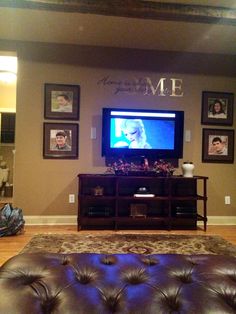 a living room filled with furniture and a flat screen tv