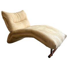 a beige chaise lounge chair on wheels