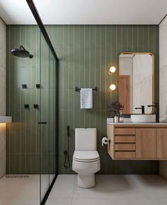 a bathroom with a toilet, sink and shower