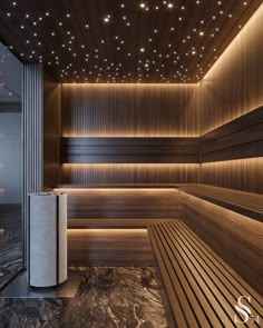 an empty wooden sauna with lights on the ceiling