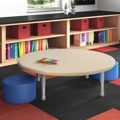 a room with tables, stools and bookshelves