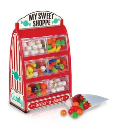 a candy dispenser with lots of gummy candies in the bins