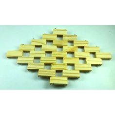 several pieces of wood are arranged in the shape of an abstract pattern on a white background