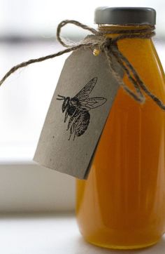 a jar of honey with a tag on it