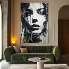 a living room filled with furniture and a large painting on the wall above it's head