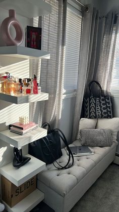 a living room filled with furniture and lots of clutter on top of the shelves