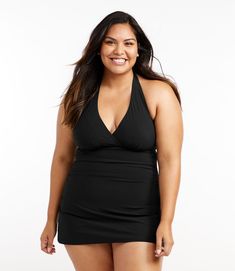 Made of breathable, quick-drying, chlorine-resistant Italian fabric, this swimsuit is made of two parts: a one-piece suit underneath for comfort and coverage, with a lightweight and flattering swimdress on top. Front length from shoulder: Regular 30", Plus 32. 5", Long 32. 25" Compressive fit Falls at thigh Liner Content: 73% nylon, 27% Lycra® Xtra Life Body Content: 72% nylon, 28% Lycra® Xtra Life Handwash, line dry. Quick Dry: Yes Stretch & Recovery: Yes, Xtra Life preserves fit for stretch th Nylon Tankini With Built-in Bra For Vacation, Fitted Tankini With Built-in Liner For Swimming, Black Swim Dress With Built-in Bra For Pool, Solid Sleeveless Swim Dress With Built-in Bra, Fitted One-piece Swim Skirt For Beachwear, Stretch Tankini With Built-in Bra For Swimming, Sleeveless Swim Dress With Built-in Bra For Pool, Swim Dress With Built-in Bra And Triangle Top, Fitted Swim Dress With Built-in Liner For Summer