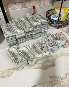 stacks of money sitting on top of a counter