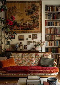 a living room filled with lots of books and furniture