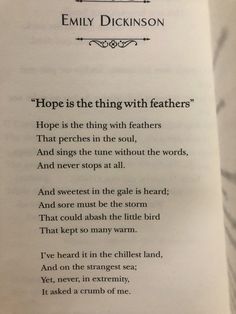 an open book with the words, hope is the thing with feathers