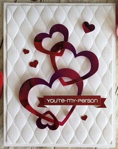 a card with hearts and the words you're my person on it