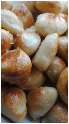 some bread rolls are sitting on a white plate