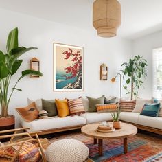 a living room filled with lots of furniture and plants