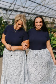 Introducing Jessa in Navy! This stylish top has a lightweight and breathable design, perfect for any occasion. The ribbed texture adds a touch of detail while the short sleeves keep you cool. With its fitted style, Jessa is flattering and comfortable. A must-have addition to your wardrobe! Model is wearing a large and is 5'5". Plus model is wearing an XL and is 5'7". This top is meant to be fitted. This top is paired with the Calla Maxi Skirt. Size Chart Length Bust S 21.5" 34" M 22" 36" L 23" 3 Navy Cotton Summer Skirt, Navy Cotton Skirt, Navy Floral Maxi Skirt, Full-length Medium Wash Cotton Skirt, Blue Floral Print Relaxed Skirt, Hanging Fabric, Keep Your Cool, Inside Out, Must Haves