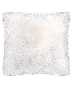 a white fur pillow on a white background