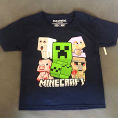 Set Of Two Shirts. One Animal Crossing One Minecraft. Never Worn. Back Is Plain. Both Size 8. Both New Without Tags. But Both Have The Plastic Piece From The Tag Cotton Character Print Tops, Character Style Cotton Short Sleeve Tops, Themed Short Sleeve Tops For Playtime, Themed Cotton Shirt With Cartoon Print, Green Themed Cotton Tops, Themed Green Cotton Tops, Themed Short Sleeve Cotton Shirt, Character Crew Neck Cotton Top, Funny Blue Tops For Playtime