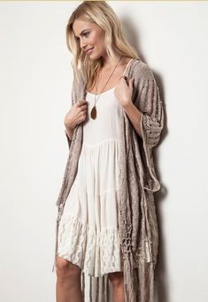 Boho Beautiful...turn any outfit into a boho masterpiece with this taupe crochet knit open poncho. Hangs beautifully with a bit of sheen to the knit. Simply stylish and stunning! 55% cotton 45% polyester S/M M/L Open Poncho, Boho Chic Top, Bohemian Crochet, Kimono Boho, Crochet Kimono, Woven Cardigan, Boho Beautiful, Fringe Kimono, Crochet Fringe