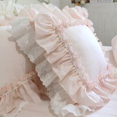 pillows with ruffled edges on a bed