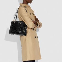 Inspired by free spirits rebels and dreamers the aptly named Rogue is a go-anywhere bag. Smaller than the original the 25 is crafted in luxurious genuine alligator. | Coach Rogue Bag 25 In Alligator - Women's Purses - Brass/black